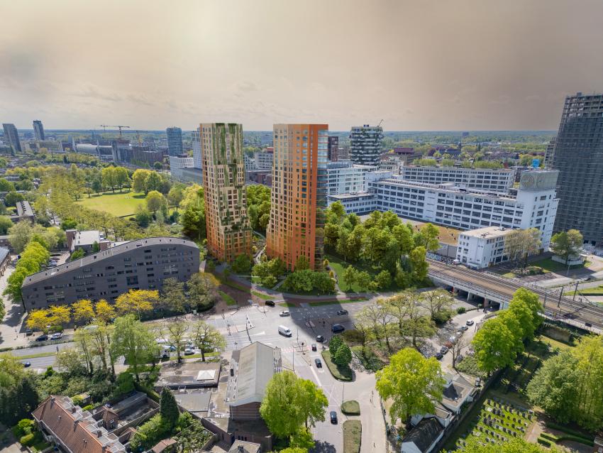 Impressie van de twee woontorens omgeven door groen