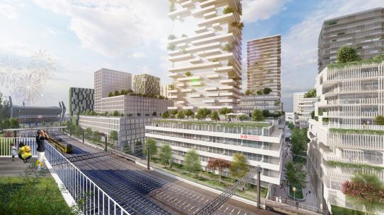 Langs het spoor hoge gebouwen en veel groen, klik voor een vergroting