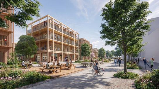 Impressie van het plein, met zicht op woningen en een café. (Foto: VenhoevenCS Architectuur + Stedenbouw), klik voor een vergroting