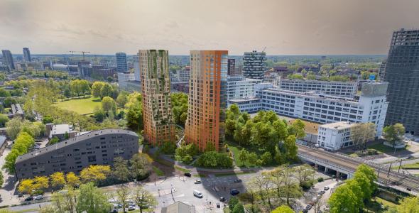 Impressie van de twee woontorens omgeven door groen